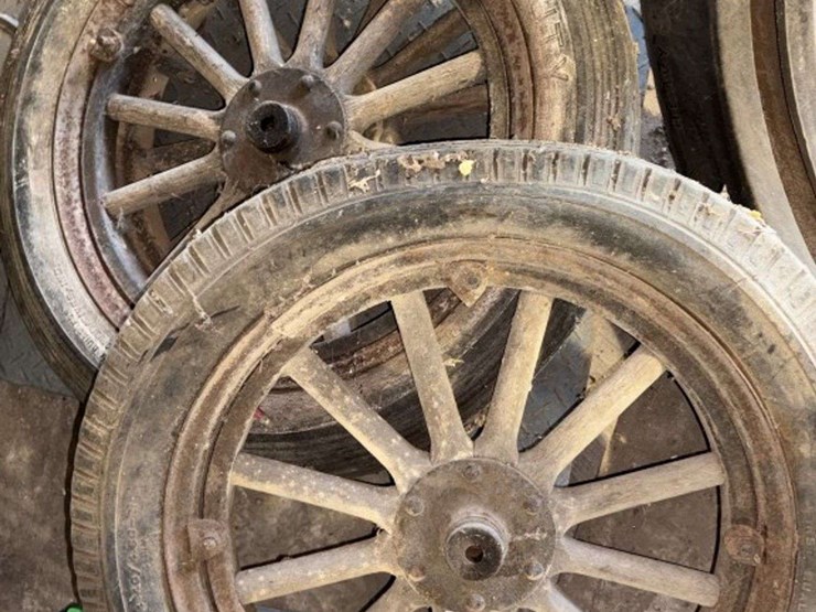 old-car-parts-including:-3-wheels-on-wood-spokes,-36x6-tire,-headlights,-windshield-image-4