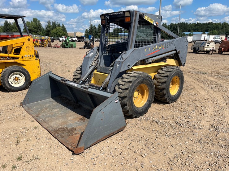 #2058-•-new-holland-l5180-skid-loader-image-1