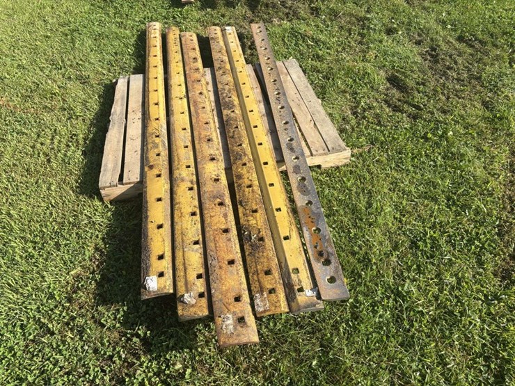 (6)-8’-used-grader-blades,-off-of-cat,-(b)-image-3