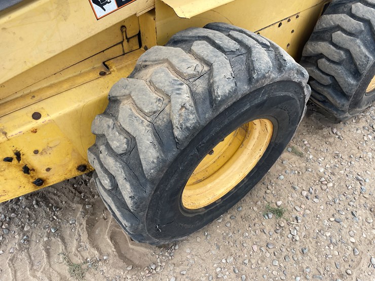#2058-•-new-holland-l5180-skid-loader-image-18