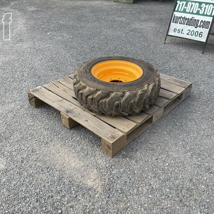 (1) NEW HOLLAND 10X16.5 WHEEL & TIRE