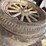 old-car-parts-including:-3-wheels-on-wood-spokes,-36x6-tire,-headlights,-windshield-image-3