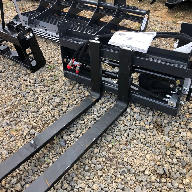 #57 • WOLVERINE 48” SKID STEER HYDRAULIC POSITIONING PALLET FORKS