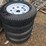 #102-•-(4)-new-15”-trailer-tires-&-wheels-image-1