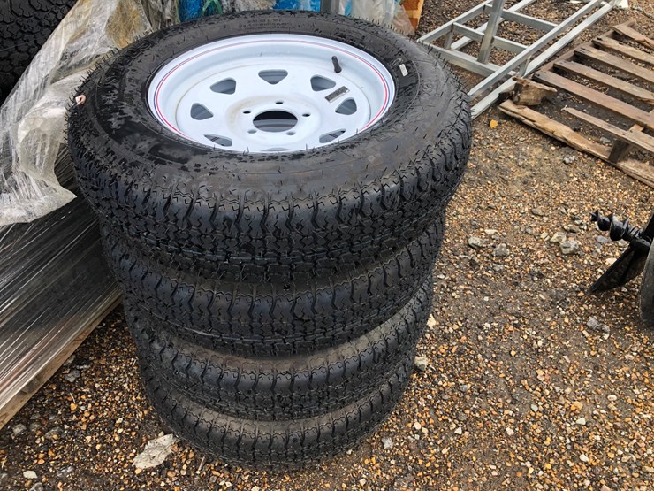 #102-•-(4)-new-15”-trailer-tires-&-wheels-image-1