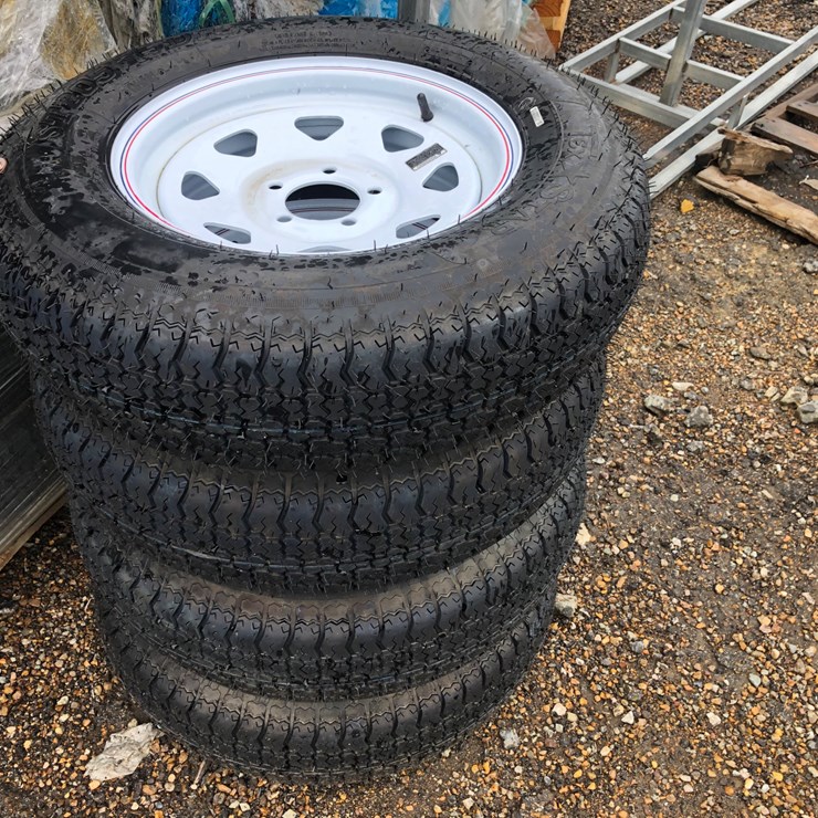 #102 • (4) NEW 15” TRAILER TIRES & WHEELS