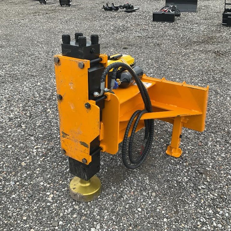#1411 • Unused Skid Steer Post Pounder