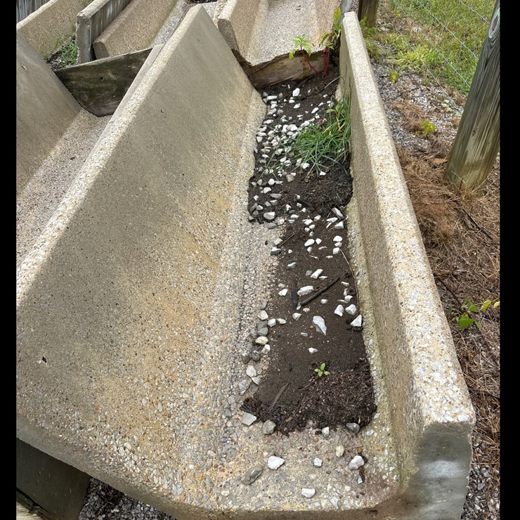 #104 • 8ft Concrete J Feed Bunks