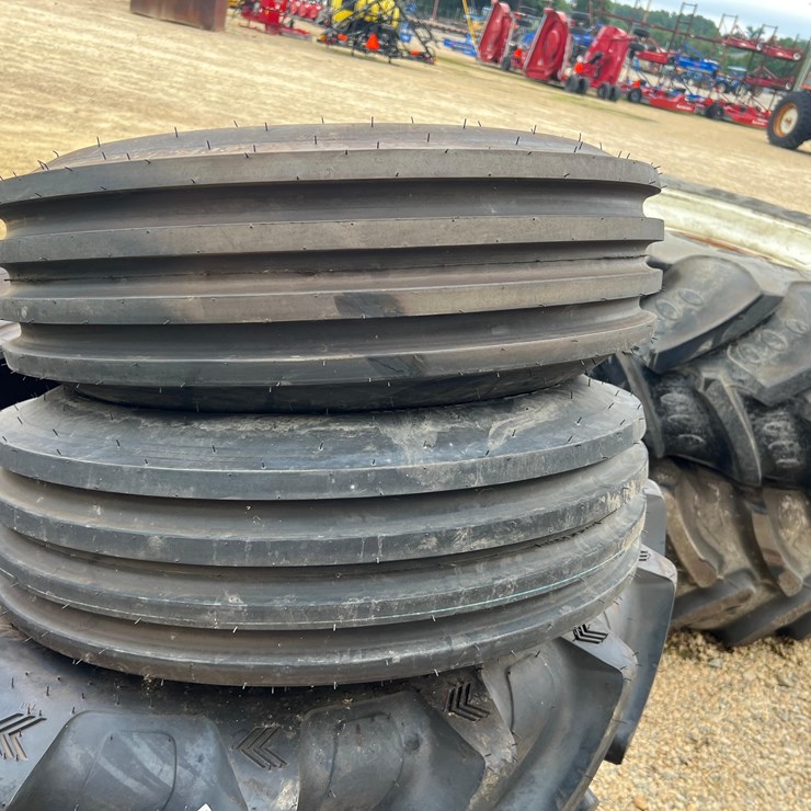 FIRESTONE 9.5L-15 4 RIB TIRES (NEW CONDITION)