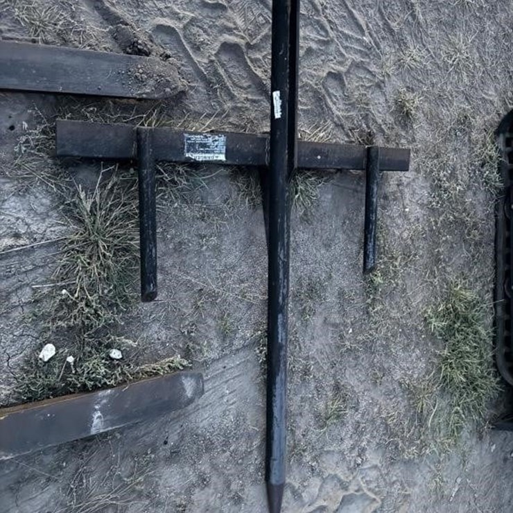 Removable bale spike for tractor bucket.