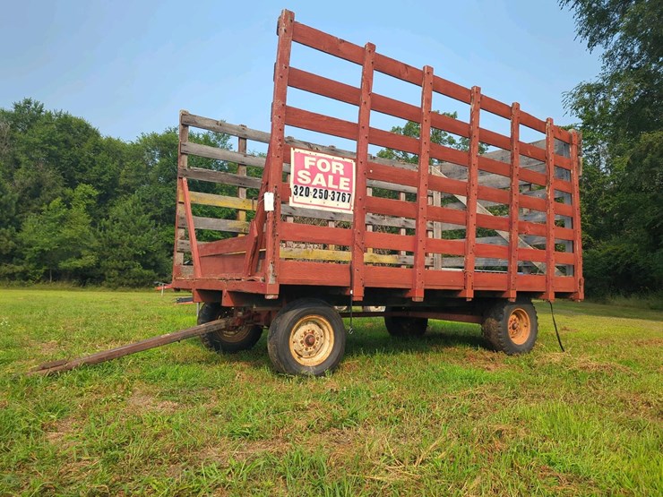 knowles-kicker-hay-rack,-16-ft-x-7-ft-x-8-ft,-5-6-ton-capacity,-wood-and-metal,-15-inch-tires.-image-1