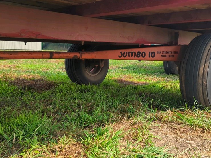 18-ft-wooden-bale-kicker-rack-on-jumbo-10-ton-wagon-(stored-inside)-image-6