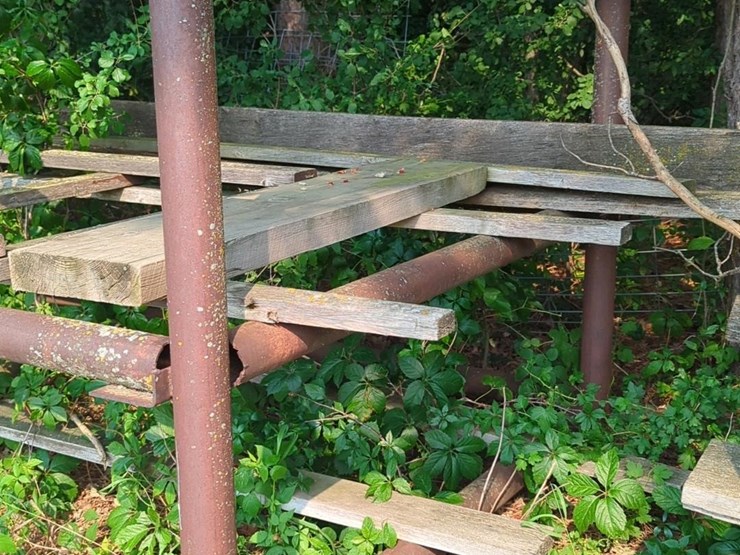 17'-x-6'-x-5'-outdoor-pipe-storage-rack-with-3-shelves,-with-assorted-lumber,-stakes,-and-large-26'-x-6"-pipe-(blue-metal-horses-not-included)-image-2
