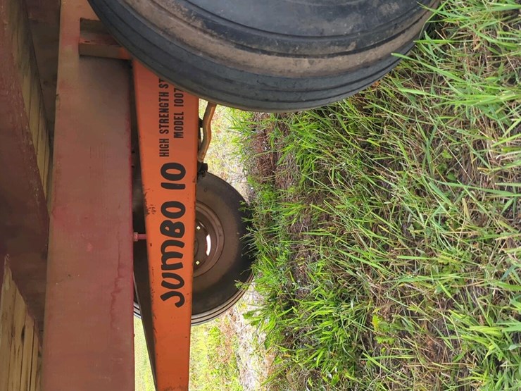 18-ft-wooden-bale-kicker-rack-on-jumbo-10-ton-wagon-(stored-inside)-image-3