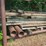 outdoor-metal-storage-rack,-3-shelves-with-assorted-lumber-&-stakes,-pipe-image-4