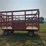 18-ft-wood-kicker-rack-with-gehl-10-ton-running-gear,-18'-long-x-8'10"-wide
(stored-inside)-image-1