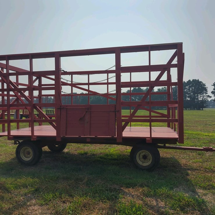 18 ft Wood Kicker Rack with Gehl 10 Ton Running Gear, 18' long x 8'10" wide
(stored inside)