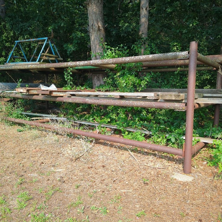 17' x 6' x 5' Outdoor Pipe Storage Rack with 3 Shelves, with assorted lumber, stakes, and large 26' x 6" pipe (Blue Metal Horses not included)