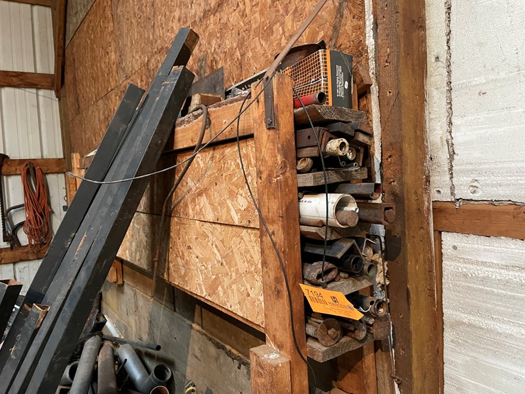 #7194-•-contents-of-shelf-hanging-on-wall-image-1