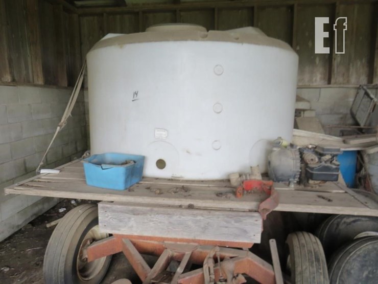 1500-gallon-poly-tank-on-rack-and-gear-image-1