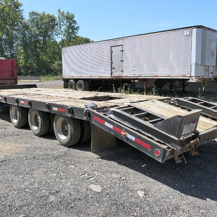 Interstate 25 Ton, Triaxle Tag Trailer, 24' Deck, 5' Beavertail, Ramps.