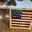 lighting-rods-and-american-flag-painted-on-old-window-image-1
