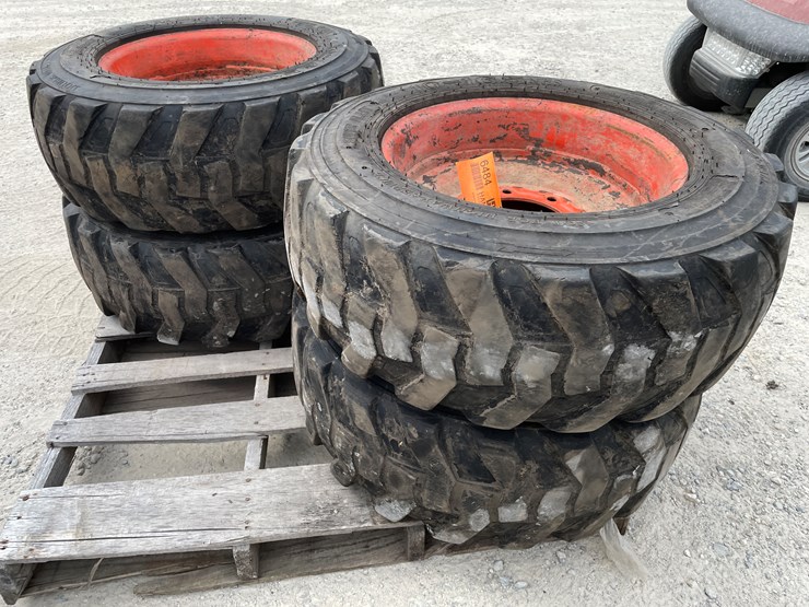 #6484-•-(4)-skidsteer-tires-and-rims-image-1