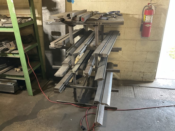 #104-•-metal-rack-with-press-dies-image-1