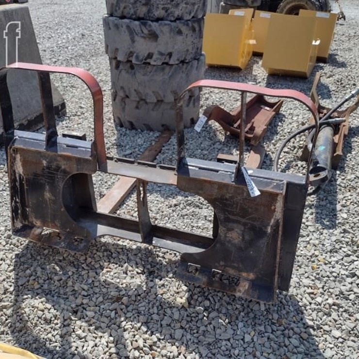 ADJUSTABLE SKID LOADER FORKS