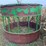 round-bale-feeder-with-hay-savor-and-skirt-on-bottom-image-3