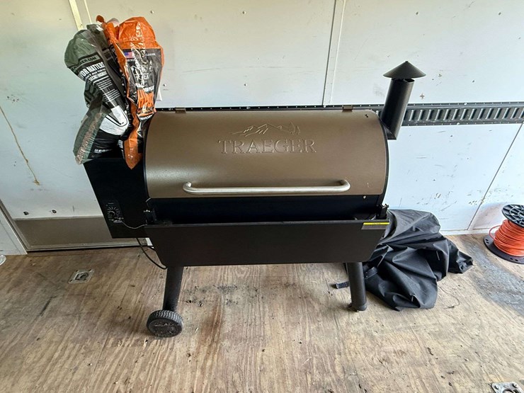 trager-pellet-grill,-always-covered-and-only-used-a-few-times,-comes-with-cover,-scraper,-chicken-ho-image-2