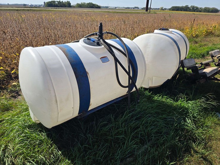 (2)-300-gallon-poly-tanks-on-saddles-with-brackets,-tanks-are-good-and-only-a-few-years-old,-mostly-image-1