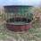 round-bale-feeder-with-hay-savor-and-skirt-on-bottom-image-1