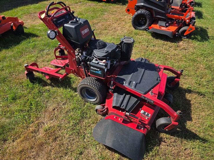 toro-grandstand-commercial-stand-on/walk-behind-lawn-mower,-tru-trak,-52”-deck,-18.5hp-kawasaki-engi-image-1