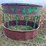 round-bale-feeder-with-hay-savor-and-skirt-on-bottom-image-5