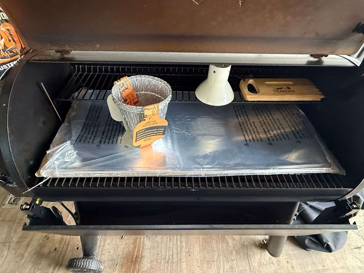 trager-pellet-grill,-always-covered-and-only-used-a-few-times,-comes-with-cover,-scraper,-chicken-ho-image-4
