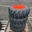 (4)-10-16.5-tires-on-wheels-for-bobcat-image-1