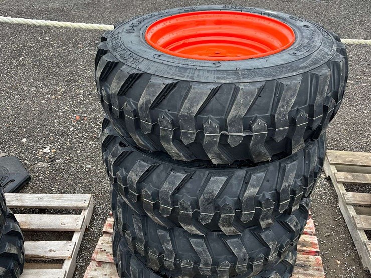 (4)-10-16.5-tires-on-wheels-for-bobcat-image-1