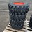 (4)-unused-12-16.5-tires-on-wheels-for-bobcat-image-1