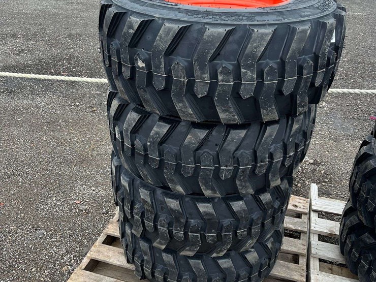(4)-unused-12-16.5-tires-on-wheels-for-bobcat-image-1