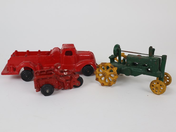#38-•-#4201-•-(3)-antique-cast-iron-toys-featuring-fire-truck,-tractor-and-motorbike-image-1