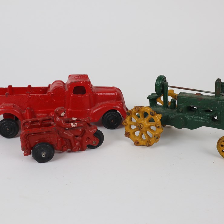 #38 • #4201 • (3) Antique Cast Iron Toys Featuring Fire Truck, Tractor and Motorbike