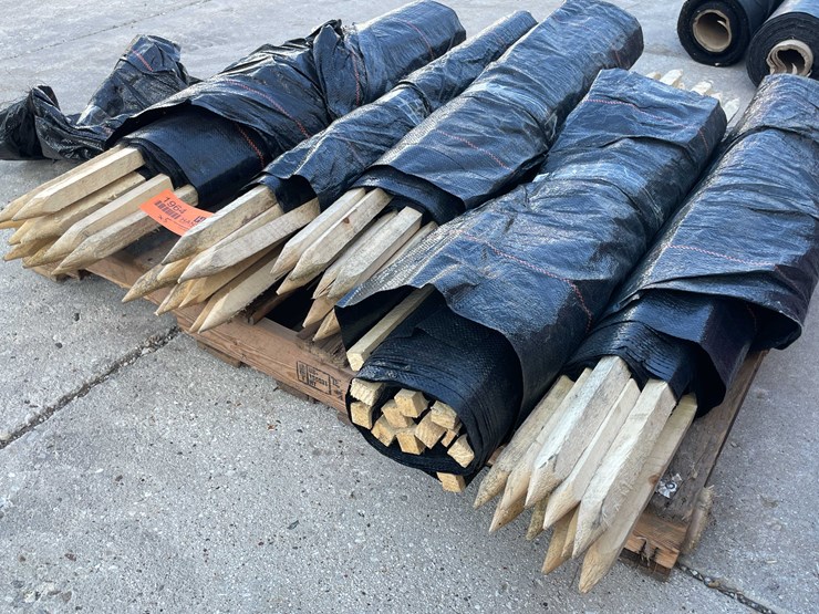 #1964-•-wood-stakes-and-tarp-fencing-image-2