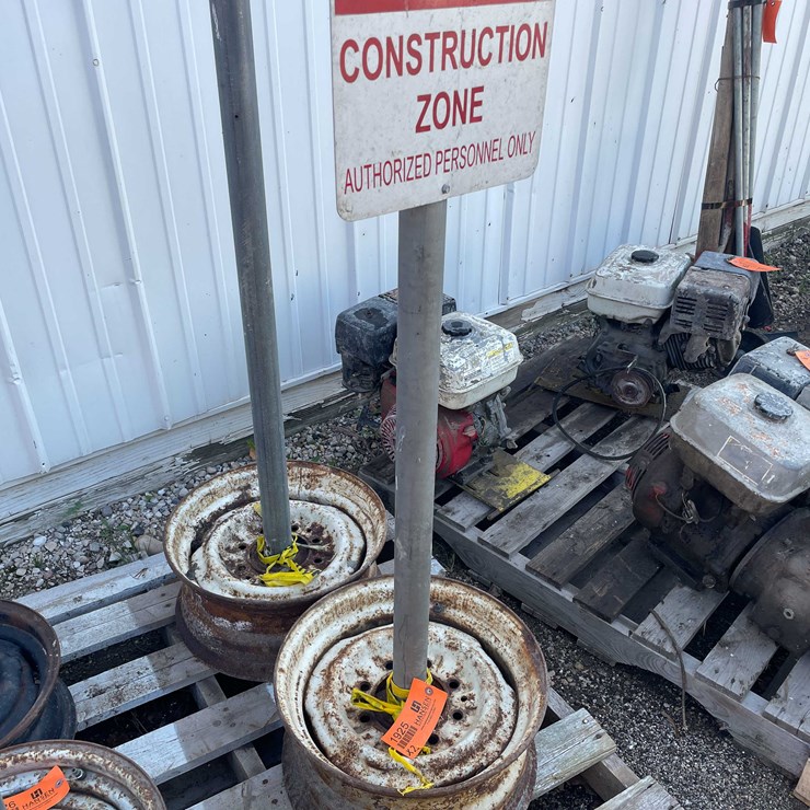 #1925 • (2) Tire Rim Base Sign Holder