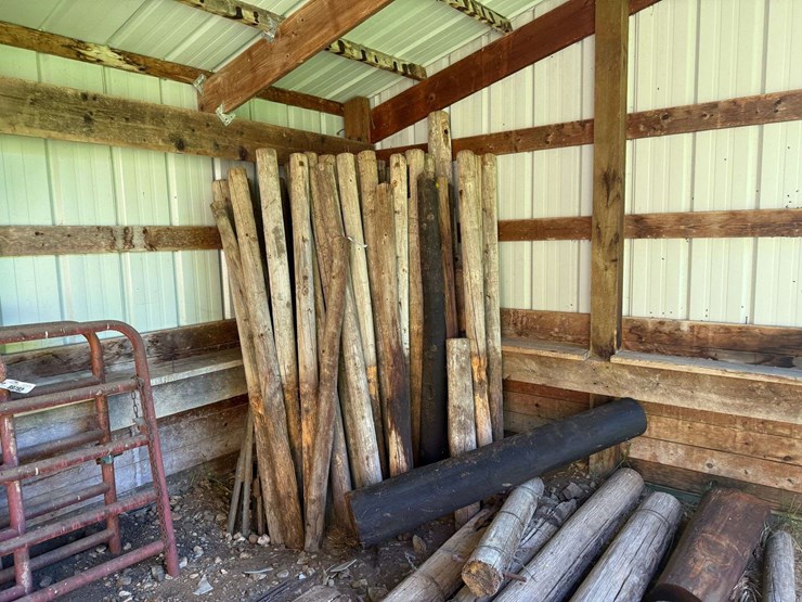 large-assortment-of-wood-fence-posts,-railroad-ties,-rebar,-wire-image-2