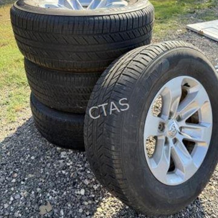 #135 • (4) 6 Lug Ram Rims & Tires - 275/65R18