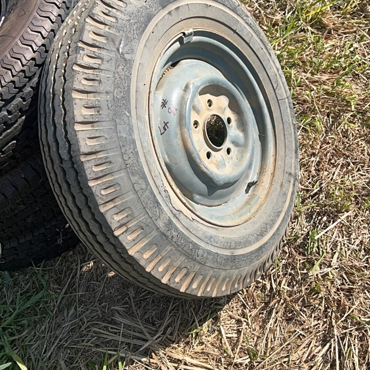 One brand new 6.00/14 bias ply light truck tire mounted on rim