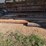 large-assortment-of-wood-fence-posts,-railroad-ties,-rebar,-wire-image-3