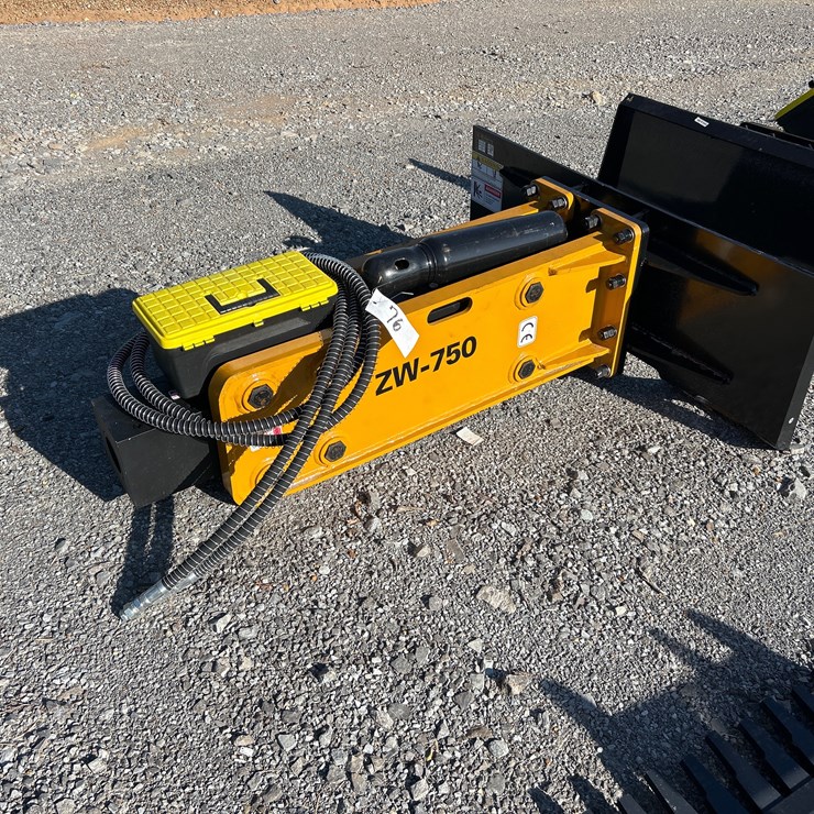 #76 • SKID STEER HYDRAULIC HAMMER W/ TWO BITS