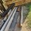 large-assortment-of-wood-fence-posts,-railroad-ties,-rebar,-wire-image-4
